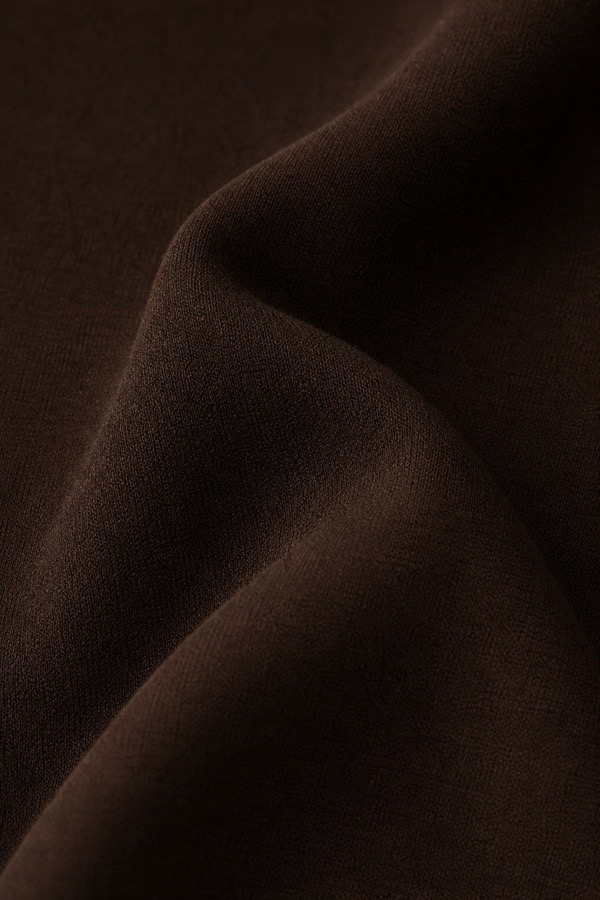 Macro detail of a fluid chocolate jersey knit